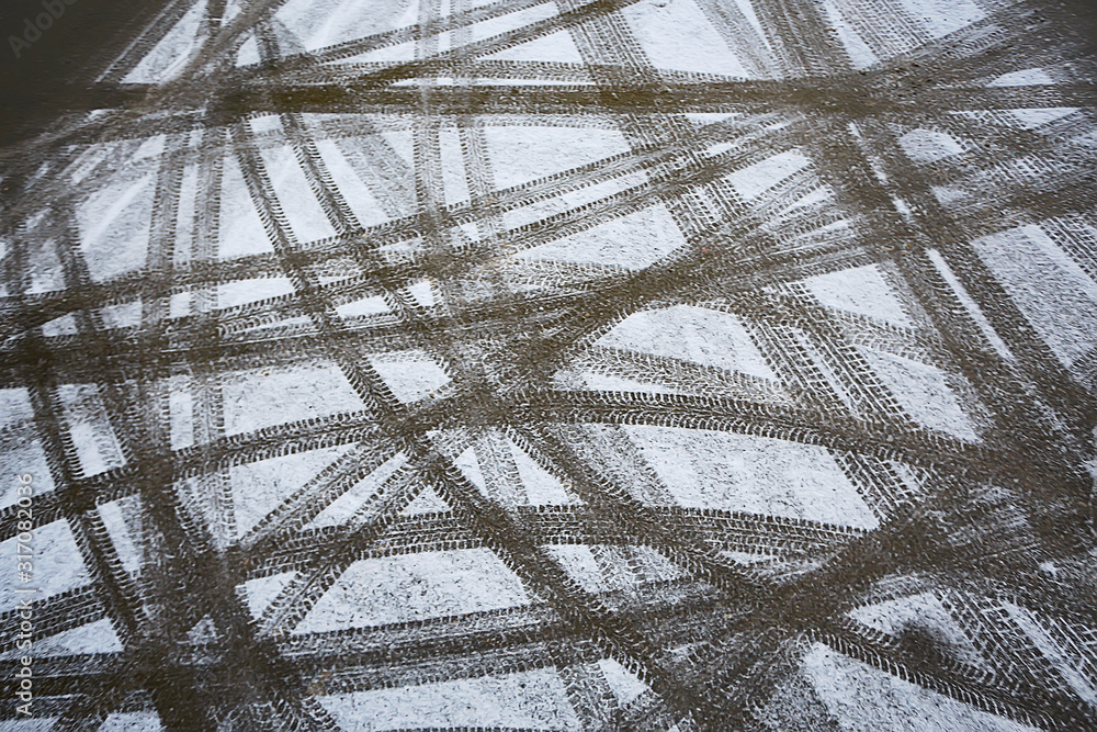 Obraz premium tire tracks on snow road, texture winter road, ice, motor transport danger background
