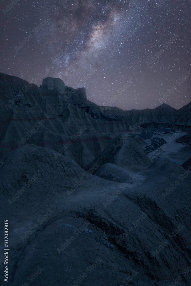 Milky way on a clear night in Bardenas spain. The picture looks like a terrain in mars or desert.
