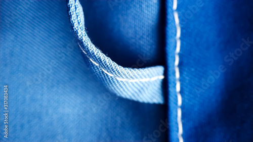 Loop on blue work clothes. workwear close-up macro seam, screed, texture photo