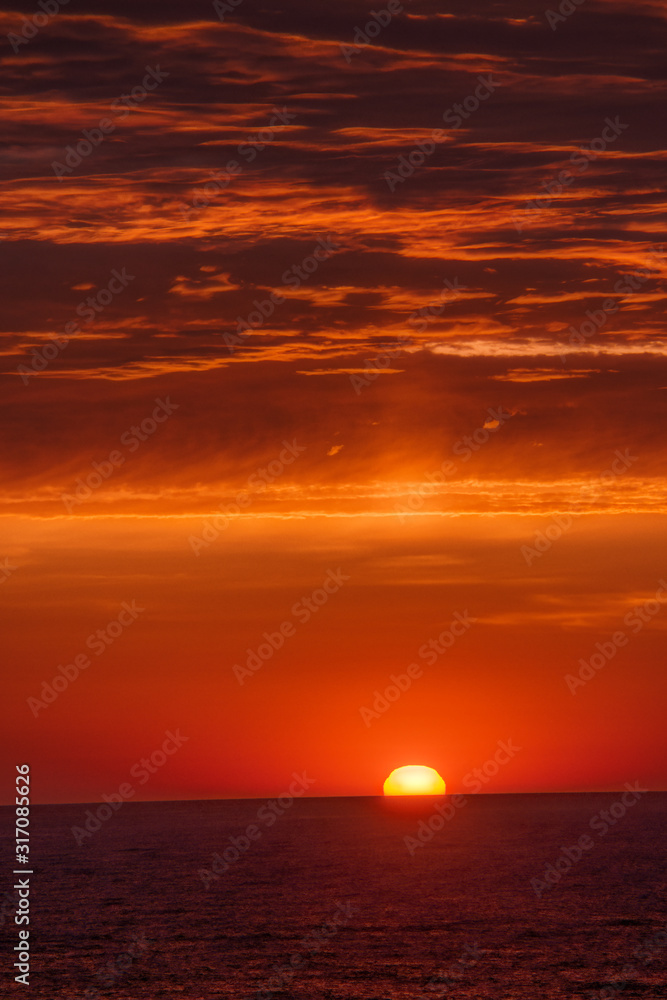 a yellow and orange morning sunrise over the Atlantic Ocean as seen from Atlantic City NJ while on vacation	