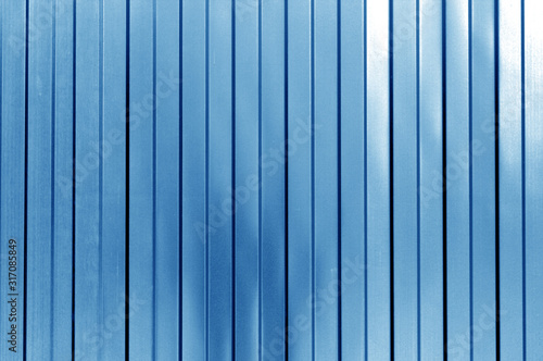 Metal list wall texture of fence in navy blue tone.