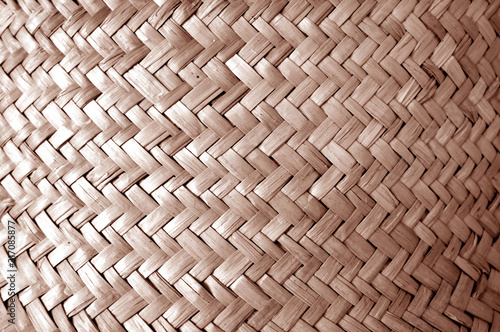 Wicker basket pattern with blur effect in brown tone.
