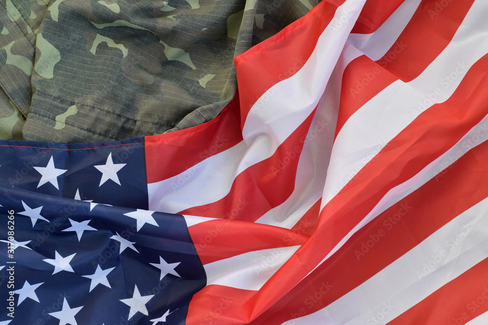 United States of America flag and folded military uniform jacket