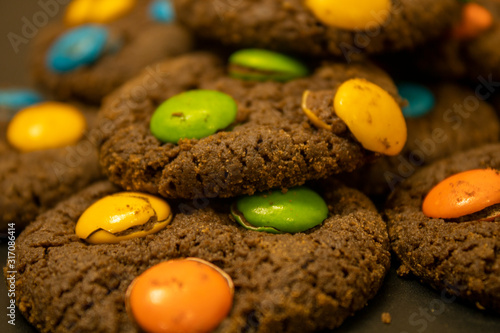 Chocolate Cookies with colorful chocolate candy for background