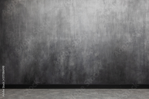 Interior with the gradient painted wall. spotty surface with copy space. Light gray wall with abstract spots and stripes.