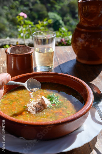 Homemade vegetables soup served with Canarian gofio flour based on local recipe of Masca village, Tenerife, Spain photo