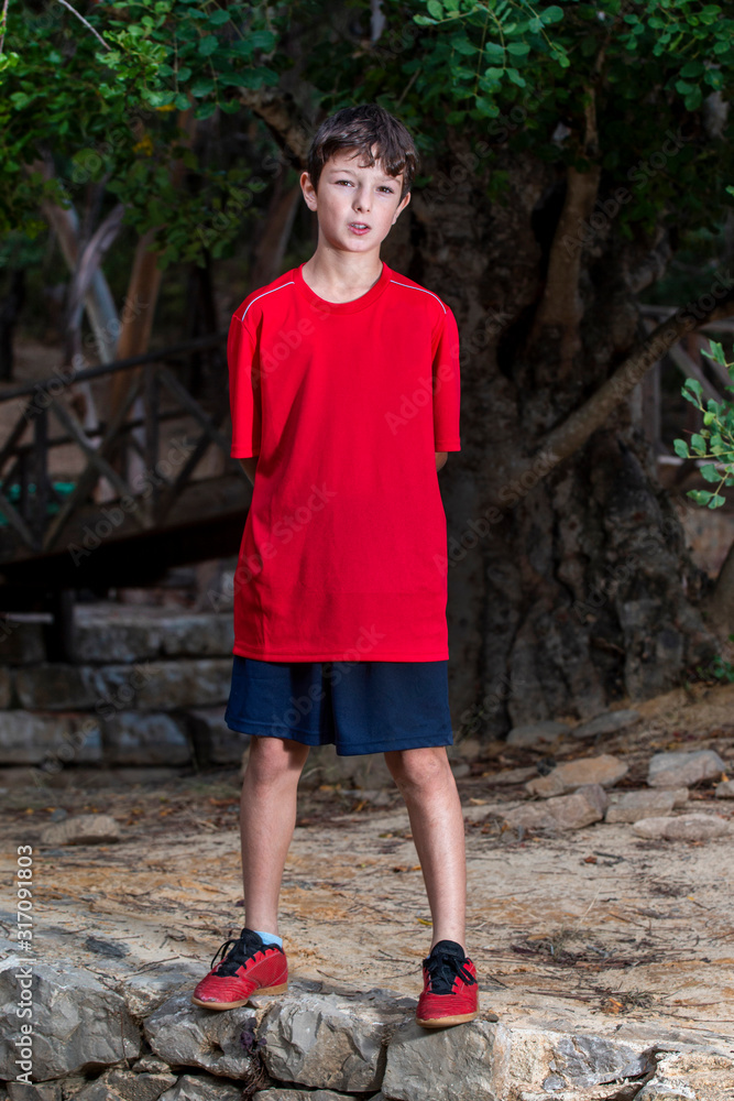 Cute boy posing with sport clothing Cute boy posing with sport clothing