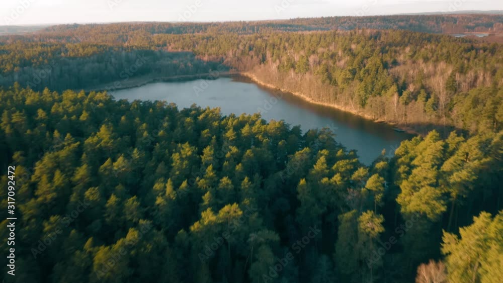 Natural lake surrounded by forest, aerial view, autumn Natural lake surrounded by forest, aerial view, autumn