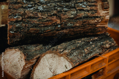 Wallpaper Mural Stack of firewood in firewood basket, close up shot Torontodigital.ca