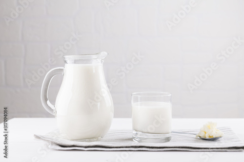 Homemade fermented beverage kefir with kefir grains in bowl on a white background, concept of natural fermented food and intestinal health