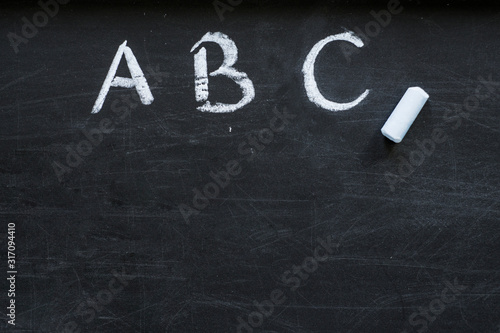 Alphabet on black chalkboard