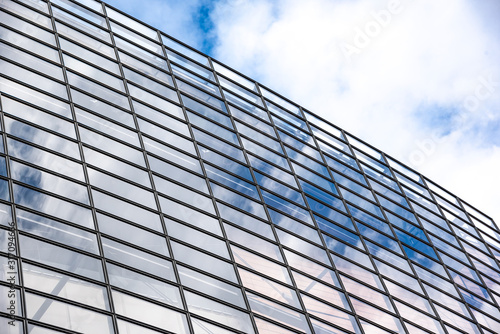 The wall of glass windows of a modern building.