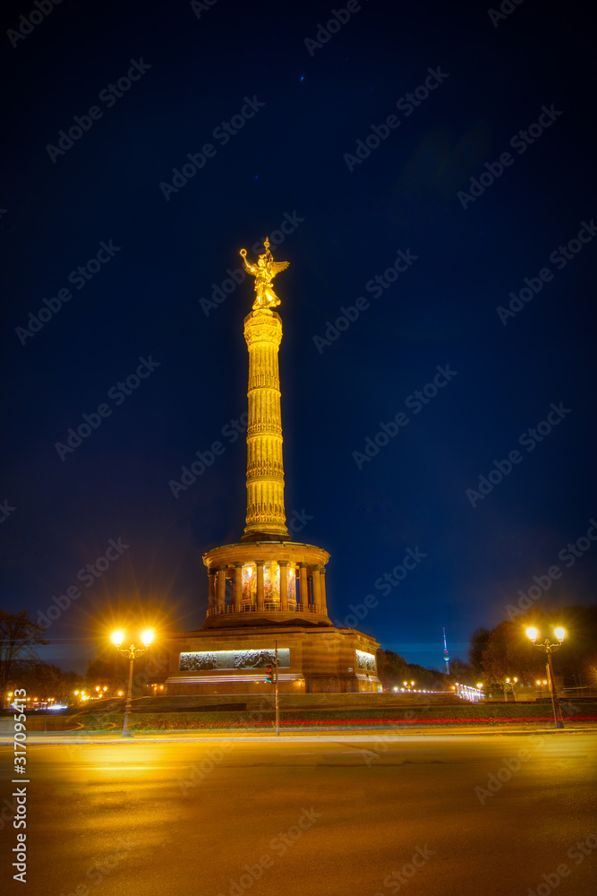 Nightshot of the illuminated victory column in Berlin