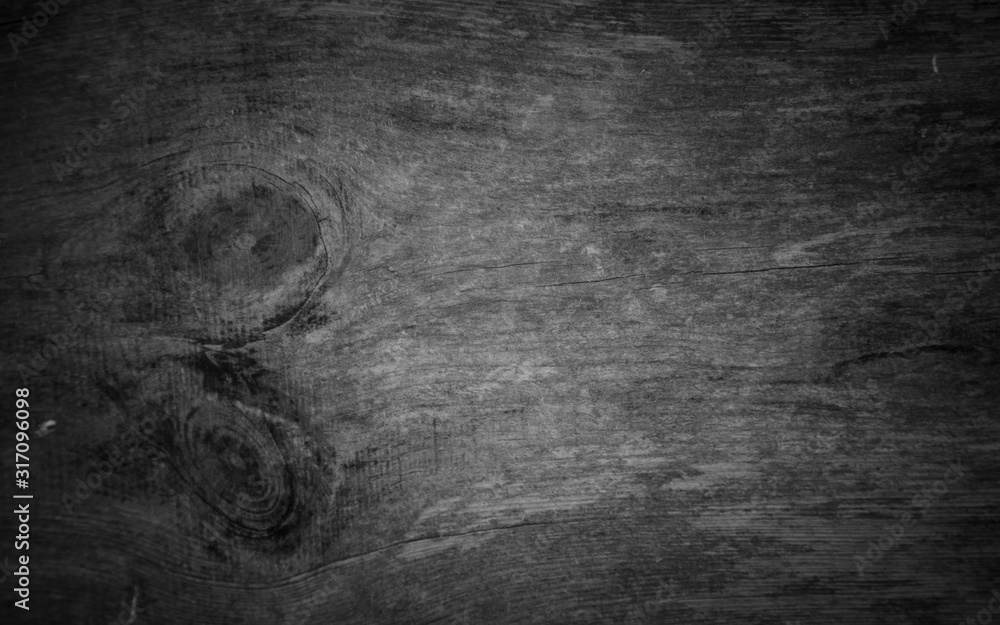 Naklejka premium Empty dark wood background to insert. space for text