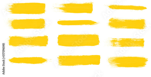 Set of yellow paint smear brushes for painting