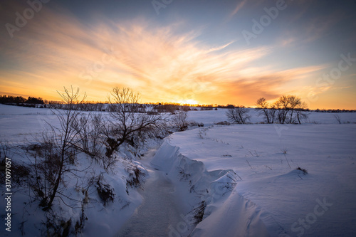 winter sunset over a frozen landscape
