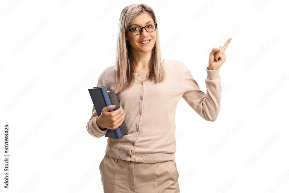 Young female teacher holding books and pointing Young female teacher holding books and pointing