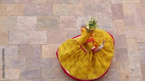 India, Rajasthan, Jaipur, woman wearing colourful Sari dancing - Model released photo