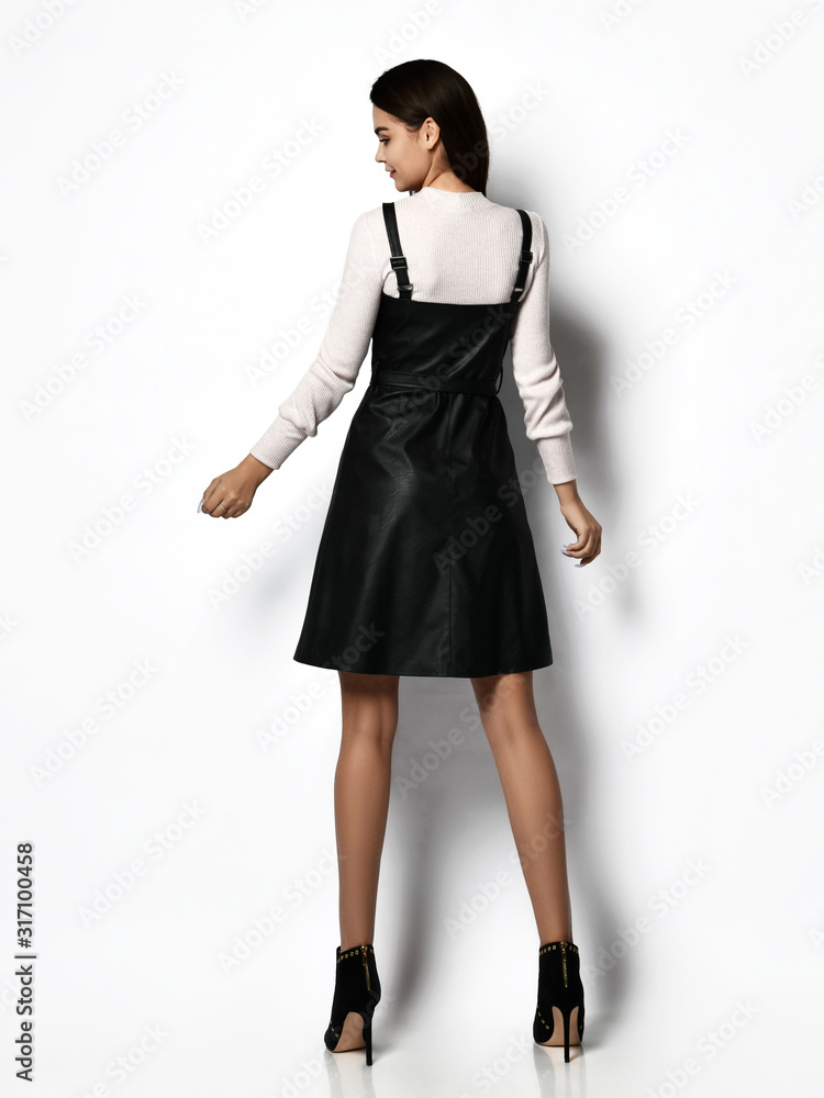 Young beautiful woman posing in casual office dress and light blouse full body Young beautiful woman posing in casual office dress and light blouse full body
