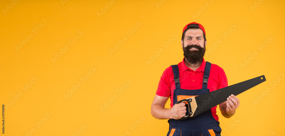 Sharp blade of saw. Dangerous job. Feeling manly. Carpenter with saw in hands. Masculinity concept. Handsome man with saw yellow background. Gardener lumberjack equipment. Tools shop copy space Sharp blade of saw. Dangerous job. Feeling manly. Carpenter with saw in hands. Masculinity concept. Handsome man with saw yellow background. Gardener lumberjack equipment. Tools shop copy space