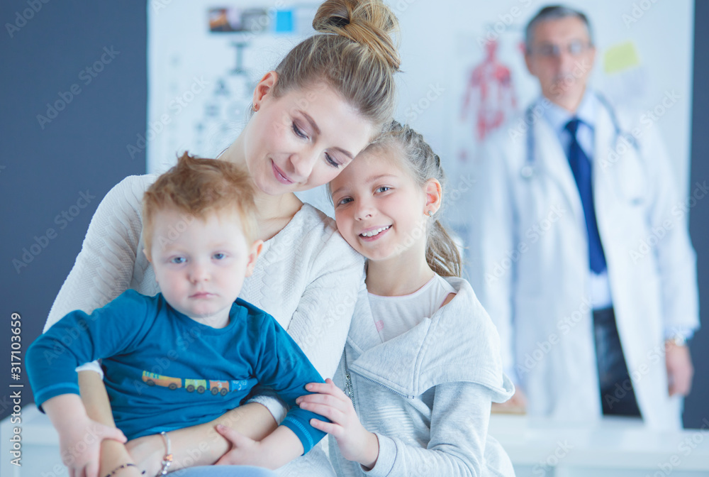 Little children with her mother at a doctor on consultation Little children with her mother at a doctor on consultation