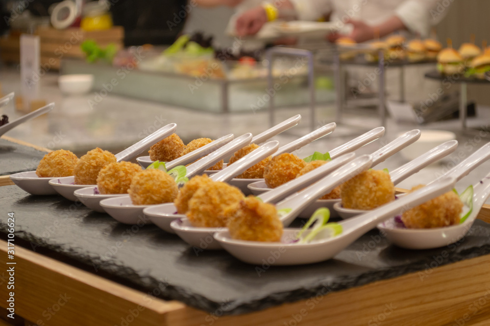 Croquettes on a decorated catering banquet table in the self service restaurant of hotel, party wedding birthday conference christmas celebration buffet.