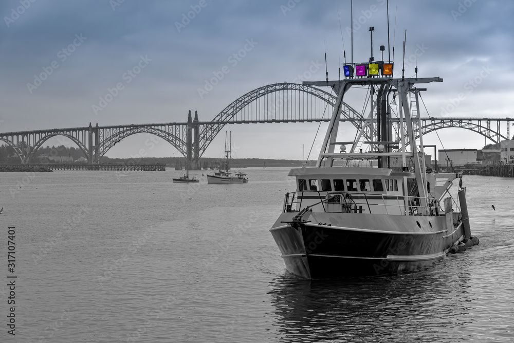 Fototapeta premium Fishing vessel returning to port Newport OR.