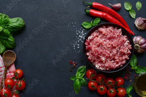 Homemade minced meat with vegetables and spices. Top view with copy space.