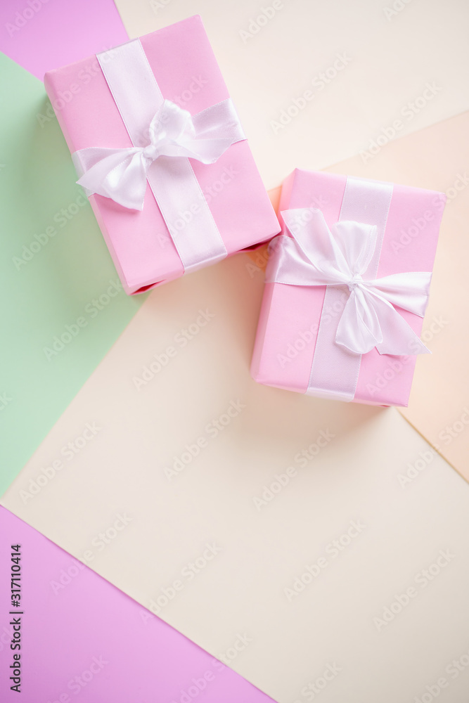 Creative background, holiday present. Handmade paper gift boxes on multicolored backdrop. Valentine's, Mother's or Women's Day. Copy space Creative background, holiday present. Handmade paper gift boxes on multicolored backdrop. Valentine's, Mother's or Women's Day. Copy space