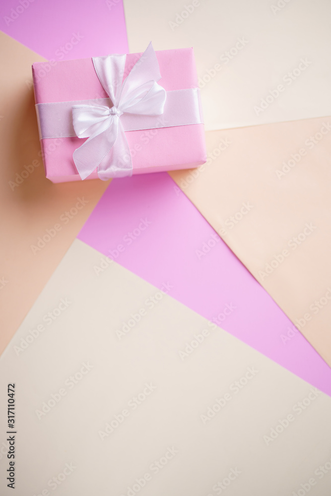Creative background, holiday present. Handmade paper gift box on multicolored backdrop. Valentine's, Mother's or Women's Day. Copy space Creative background, holiday present. Handmade paper gift box on multicolored backdrop. Valentine's, Mother's or Women's Day. Copy space