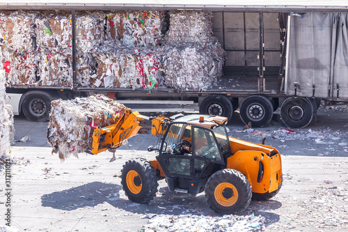 Loading waste paper into the truck