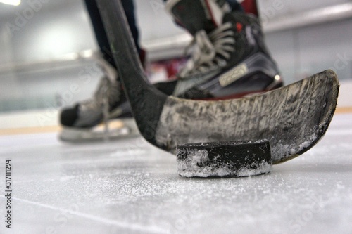 hockey player with stick and puck