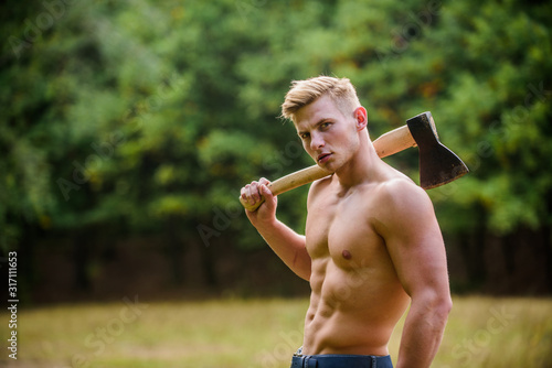 Fototapeta Naklejka Na Ścianę i Meble -  You can do it. Lumberjack woodman sexy naked athletic torso. Masculine concept. Illegal logging. woodsman with axe in hand. muscular man with axe. sexy macho bare belly ax. bodybuilding concept