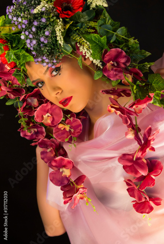 Fototapeta Naklejka Na Ścianę i Meble -  beautiful caucasian woman with vivid flower crown