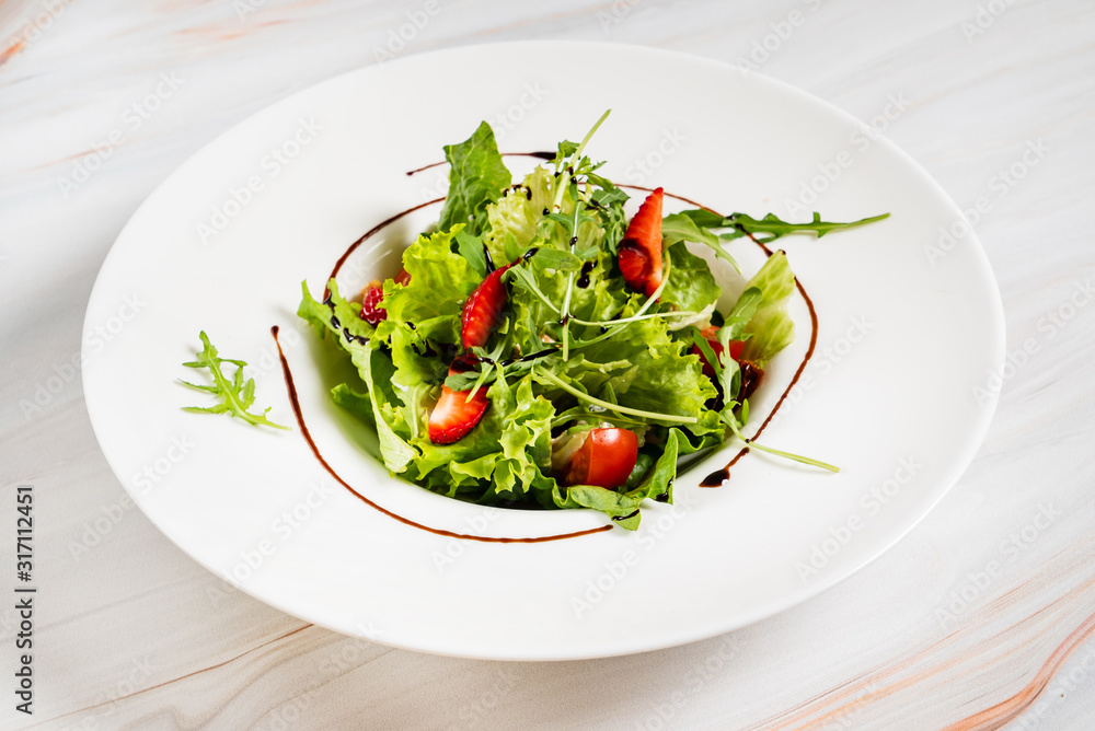 healthy salad with strawberriesa and arugula healthy salad with strawberriesa and arugula