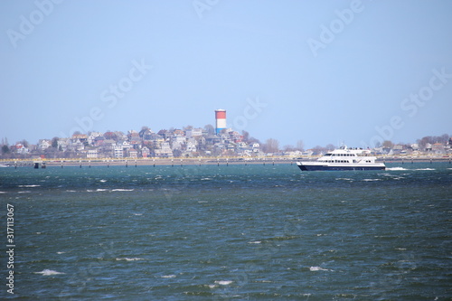 lighthouse and cruise ship
