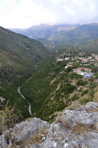 View of Himare, mountains and the bed of a dried river, Albania.