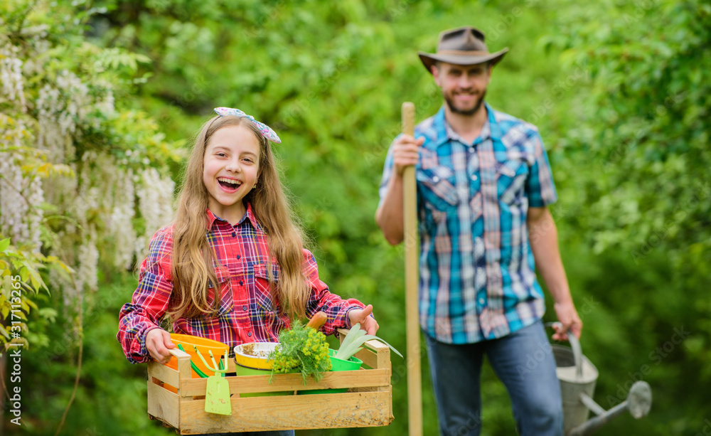 Planting flowers. Phases of moon help determine best time plant garden. Family dad and daughter planting plants. Transplanting vegetables from nursery gardening center. Plant veggies. Planting season Planting flowers. Phases of moon help determine best time plant garden. Family dad and daughter planting plants. Transplanting vegetables from nursery gardening center. Plant veggies. Planting season