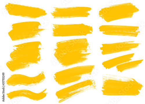 Set of yellow paint smear brushes. Beautiful set brushes