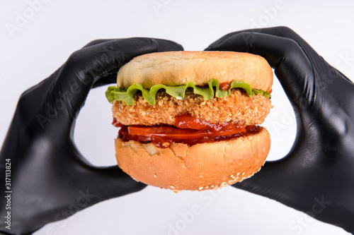  phased assembly of a hamburger on a white background51 photo