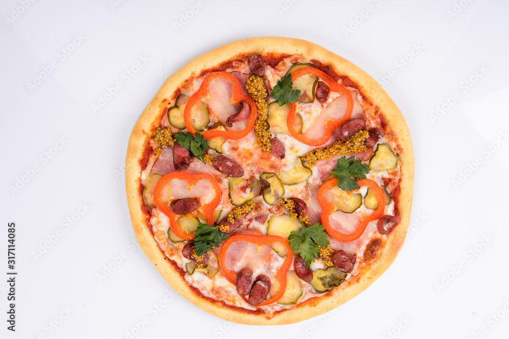 pizza with ham cheese pickles mustard hunting sausages and red bell pepper on a white background