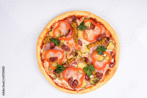pizza with ham cheese pickles mustard hunting sausages and red bell pepper on a white background