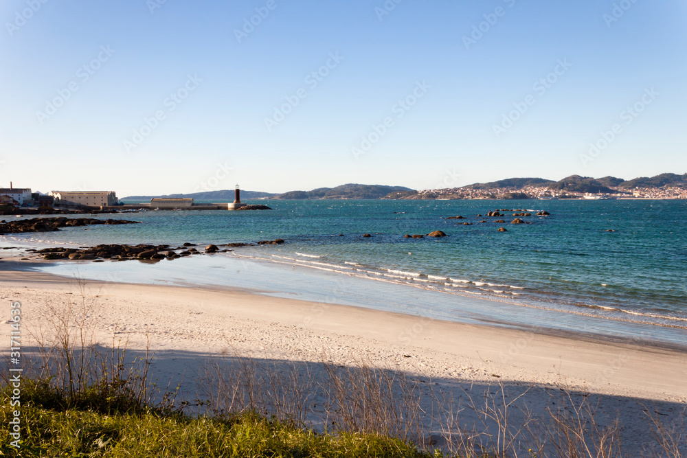 View of Vigo estuary, Sea Museum beacon and Cangas village from Carril beach
