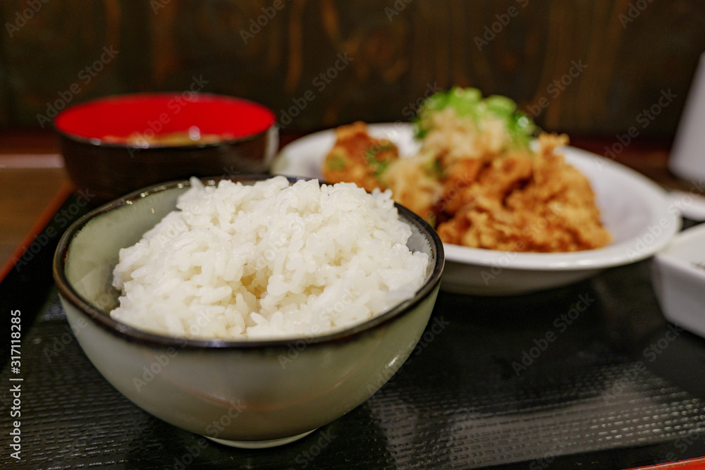 Selected focus view at rice bowl of Japanese style Deep fried Chicken menu, Tori Kara or Tori Pon, serve with miso soup and rice on side. Selected focus view at rice bowl of Japanese style Deep fried Chicken menu, Tori Kara or Tori Pon, serve with miso soup and rice on side.