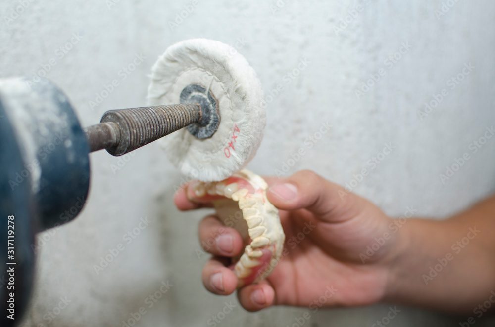 Dental laboratory work, polishing teeth and prostheses
