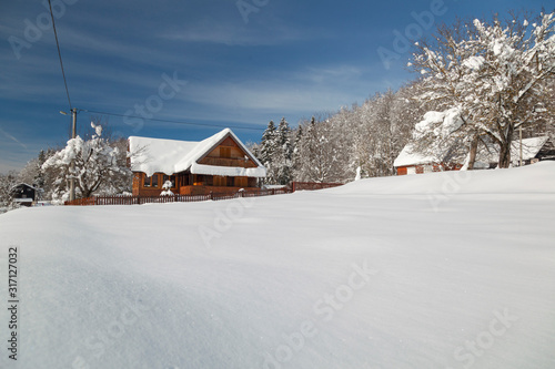 Winter with deep now in wooden village in Lika, Croatia © Goran