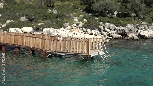 Andrea Doria Bay, Finike, Turkey - 10th of January 2020: 4K Wooden platform bridge in the Andrea Doria bay photo