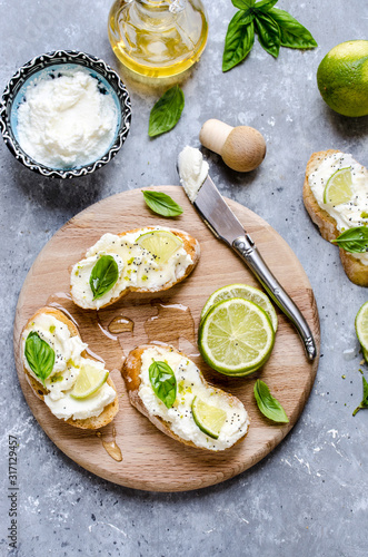 Bruschetta with ricotta and lime with honey and poppy seeds