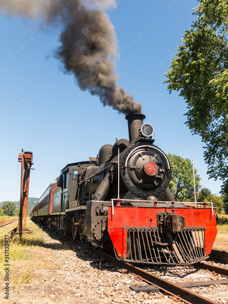 Obraz premium Tourist train called Valdiviano that runs from Valdivia to Antilhue with a 1913 North British locomotive type 57. Los Rios Region, in southern Chile.