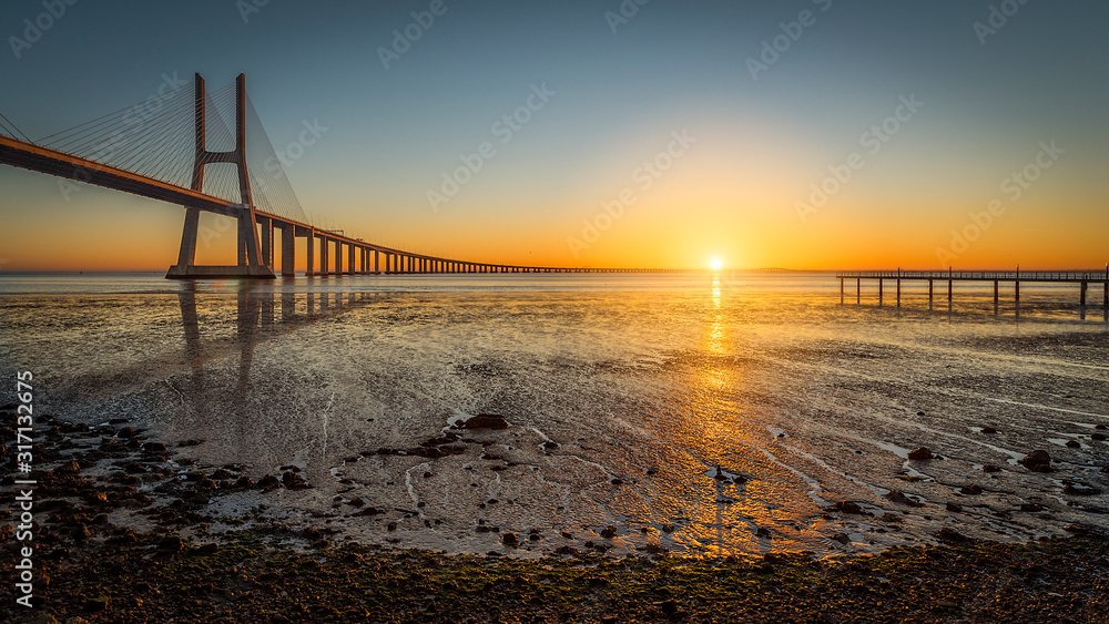 Vasco de Gama bridge at sunrise with sunrise
